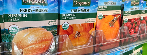 A selection of Ferry-Morse Organic seeds sitting on a retail shelf for shoppers to choose from.